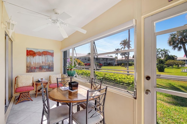 sunroom featuring ceiling fan