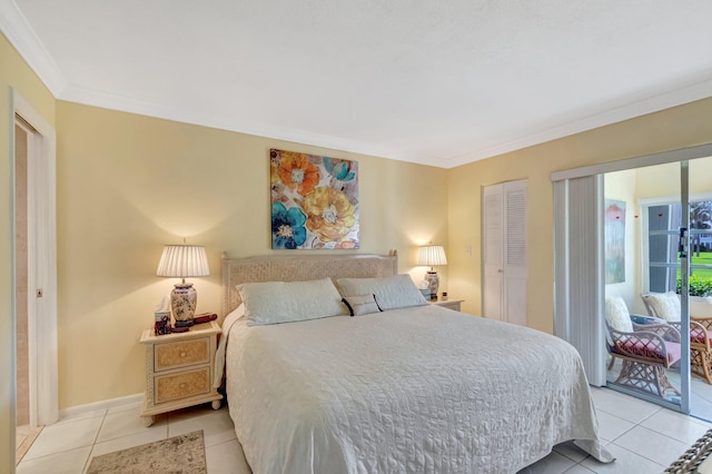 bedroom with light tile patterned floors, a closet, crown molding, and baseboards