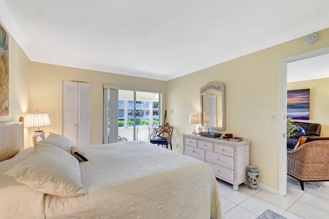 bedroom with crown molding, light tile patterned floors, and baseboards