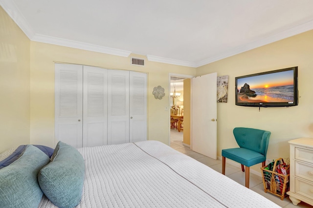 bedroom with a closet, visible vents, light tile patterned floors, and ornamental molding