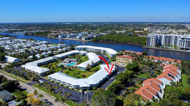 birds eye view of property with a water view