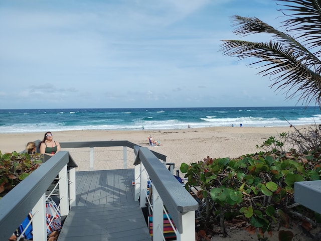 property view of water featuring a beach view