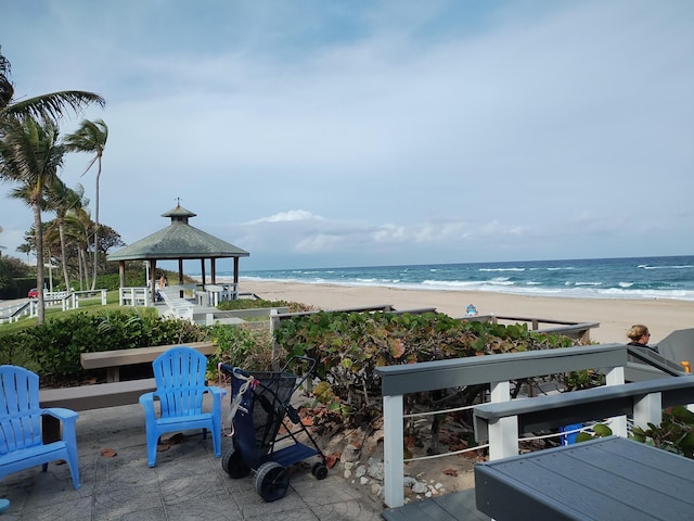 property view of water featuring a gazebo and a view of the beach