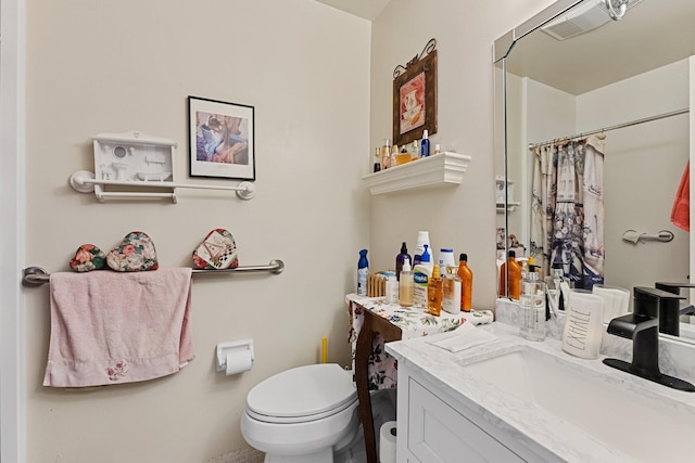 full bathroom with vanity, toilet, and a shower with shower curtain