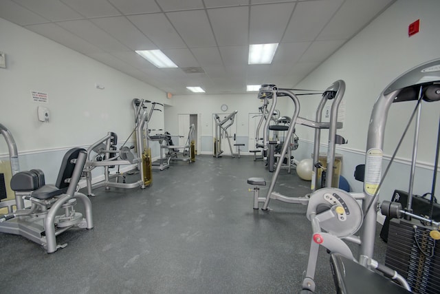 gym featuring a drop ceiling