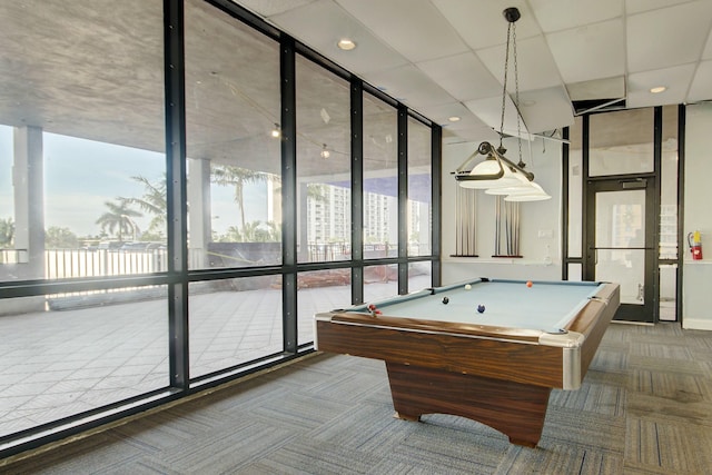 recreation room with carpet flooring, a wall of windows, plenty of natural light, and billiards