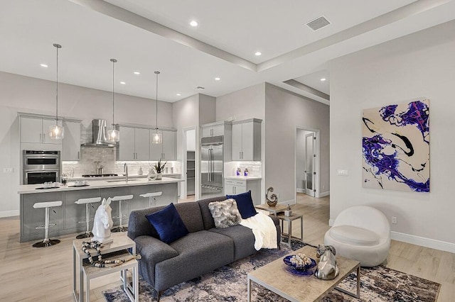 10097 Driftwood Way, Palm Beach Gardens, FL 33412 - living room featuring baseboards, light wood finished floors, recessed lighting, and visible vents