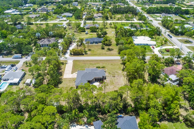 aerial view of property's location featuring nearby suburban area