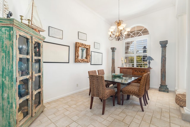 dining space featuring a chandelier, baseboards, decorative columns, and light stone finish floors