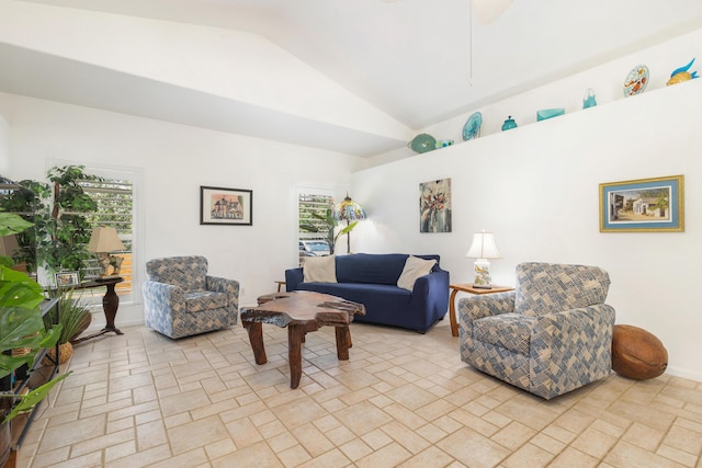 living room featuring lofted ceiling and a ceiling fan