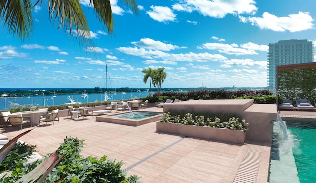 view of swimming pool featuring a water view