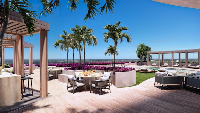 view of patio / terrace featuring outdoor dining area, a community pool, outdoor dry bar, and a pergola