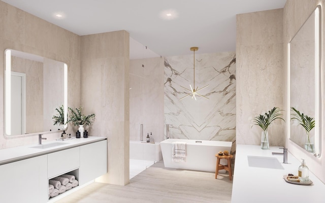 bathroom featuring vanity, a soaking tub, recessed lighting, and tile walls