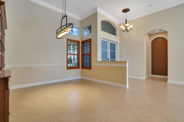 tiled empty room featuring baseboards, arched walkways, an inviting chandelier, and ornamental molding