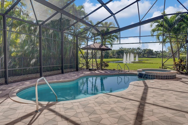 10733 Castle Oak Dr, Boynton Beach, FL 33473 - view of swimming pool featuring glass enclosure, a yard, a patio area, and a pool with connected hot tub