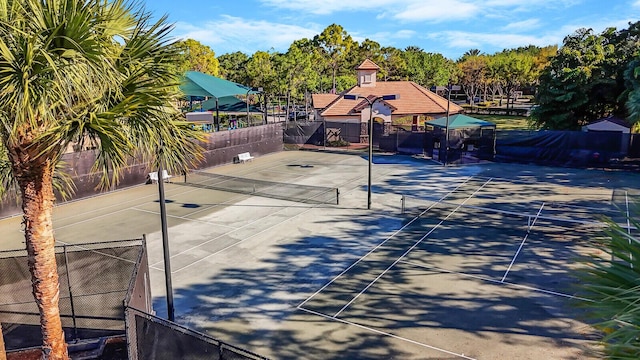 view of sport court with fence