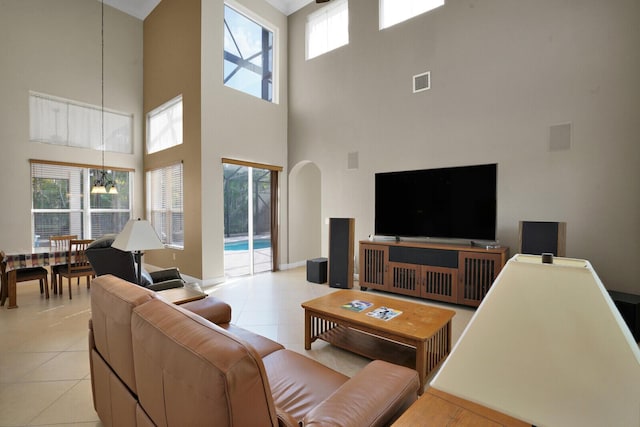 10733 Castle Oak Dr, Boynton Beach, FL 33473 - living area featuring light tile patterned floors, a notable chandelier, baseboards, and visible vents