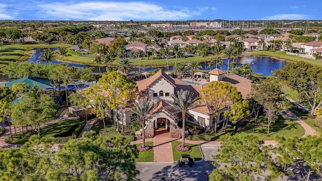 drone / aerial view with a residential view and a water view