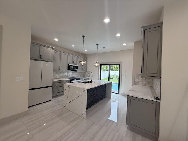 580 Lucky Ln, Delray Beach, FL 33444 - kitchen featuring stainless steel microwave, refrigerator, gray cabinetry, electric stove, and a sink