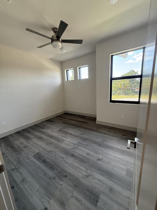580 Lucky Ln, Delray Beach, FL 33444 - empty room with ceiling fan, baseboards, and dark wood finished floors