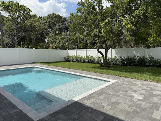 580 Lucky Ln, Delray Beach, FL 33444 - view of pool featuring a fenced in pool, a yard, a patio, and a fenced backyard
