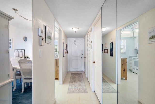 hallway featuring a textured ceiling