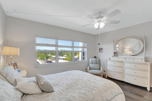 bedroom with wood finished floors and a ceiling fan