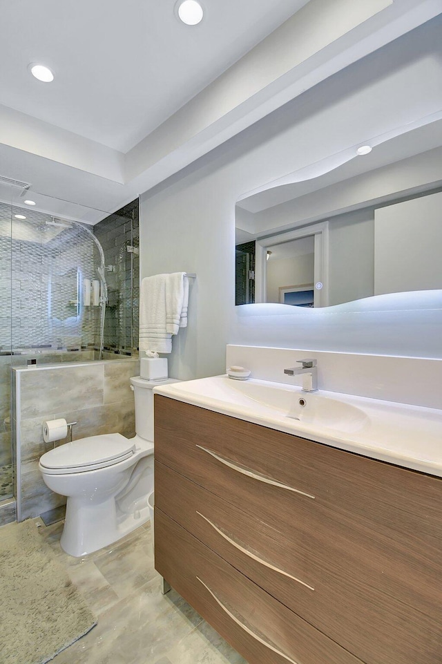 full bath with vanity, toilet, recessed lighting, and a stall shower