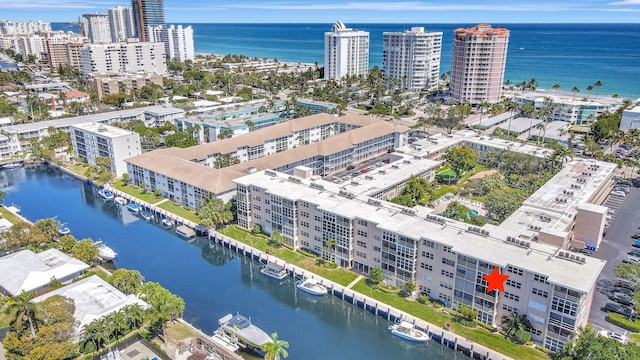 bird's eye view featuring a water view and a city view