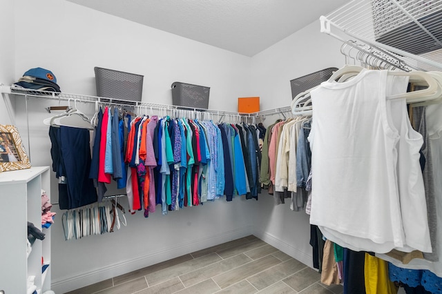 spacious closet with wood tiled floor