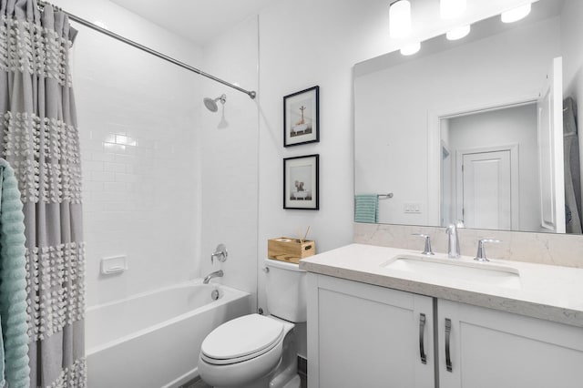 bathroom featuring toilet, vanity, and shower / tub combo