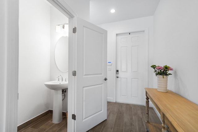 bathroom featuring baseboards and wood finished floors