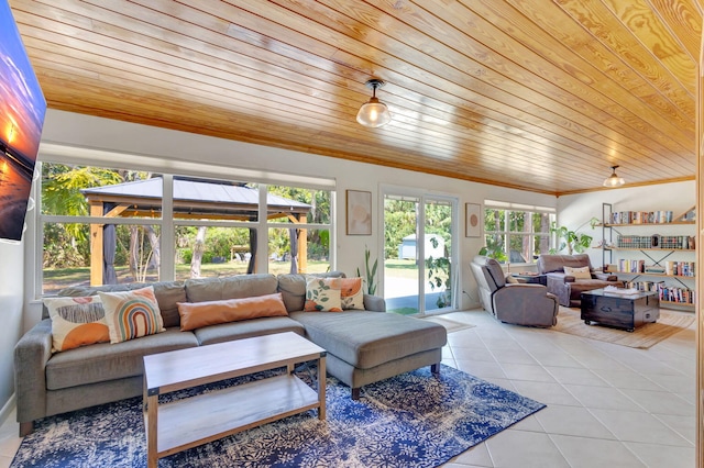 tiled living area featuring wood ceiling and crown molding