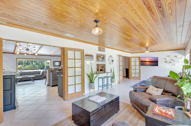 living area featuring visible vents, wood ceiling, ornamental molding, light tile patterned floors, and french doors