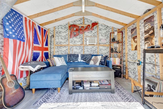 living room featuring vaulted ceiling with beams and wood finished floors