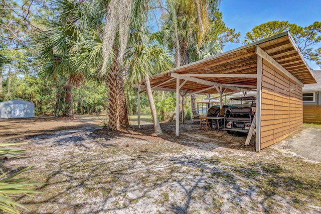 view of outdoor structure featuring an outbuilding and a detached carport