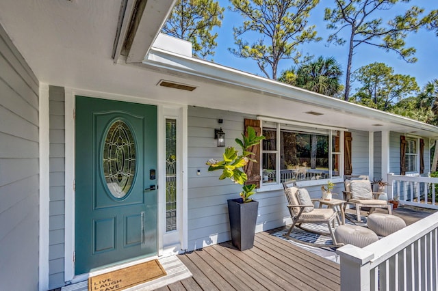 entrance to property featuring covered porch