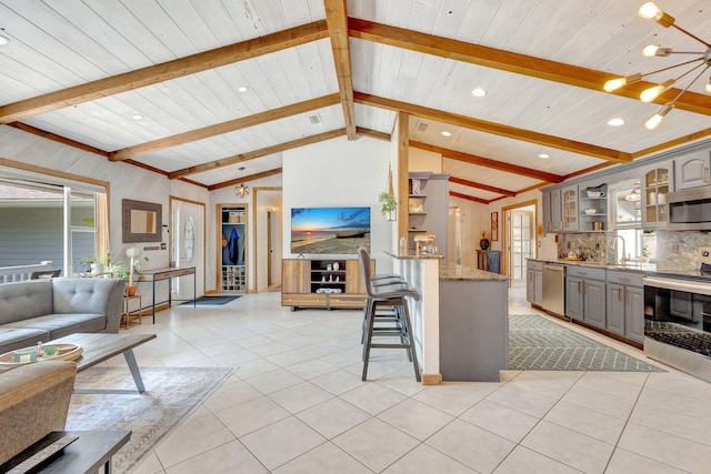 interior space featuring vaulted ceiling with beams, light tile patterned floors, recessed lighting, wooden ceiling, and a notable chandelier