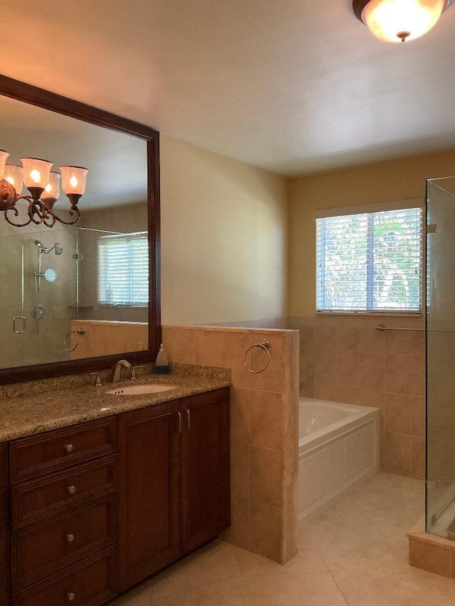 bathroom with tile patterned floors, tiled shower, and plenty of natural light