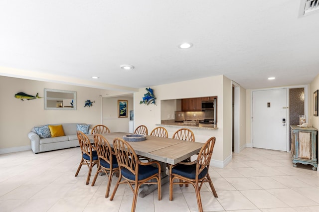 dining space with recessed lighting, visible vents, baseboards, and light tile patterned flooring