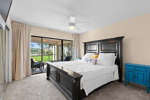 bedroom featuring access to exterior, light colored carpet, and a ceiling fan