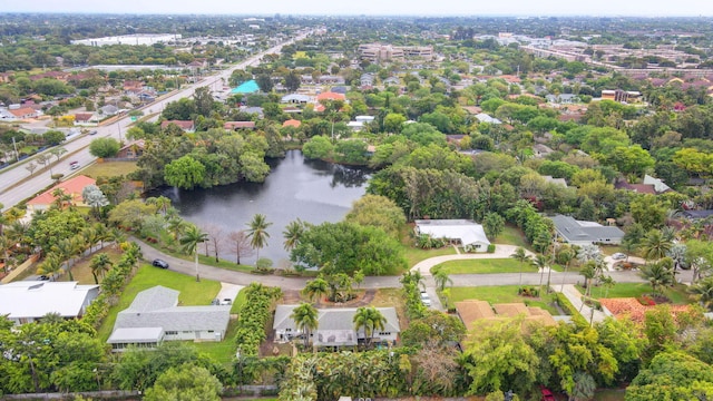 birds eye view of property with a water view and a residential view