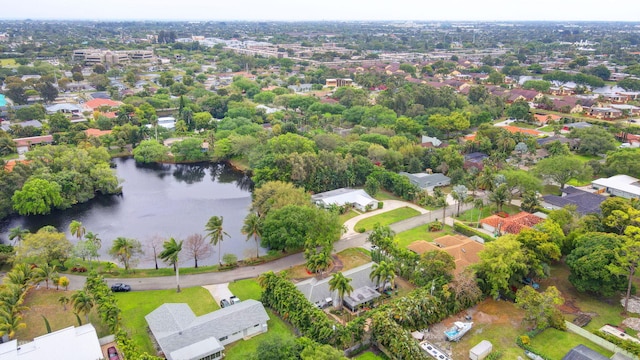 drone / aerial view featuring a residential view and a water view