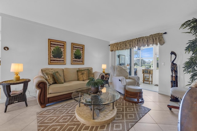 living room featuring light tile patterned floors and baseboards