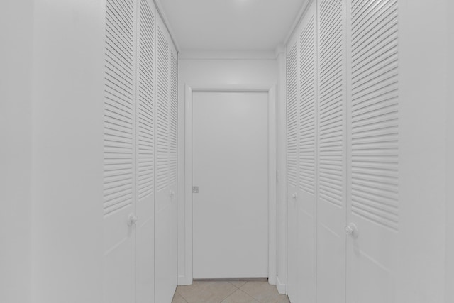 hallway with light tile patterned floors