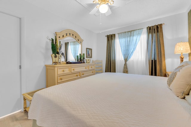 bedroom featuring baseboards and ceiling fan