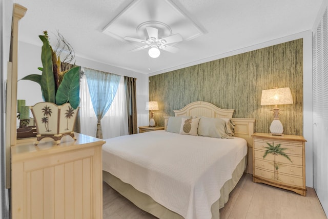 bedroom with ceiling fan and light wood finished floors