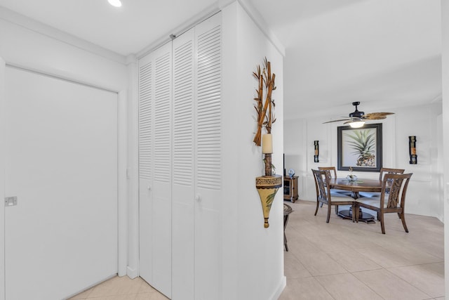 corridor featuring light tile patterned floors and recessed lighting