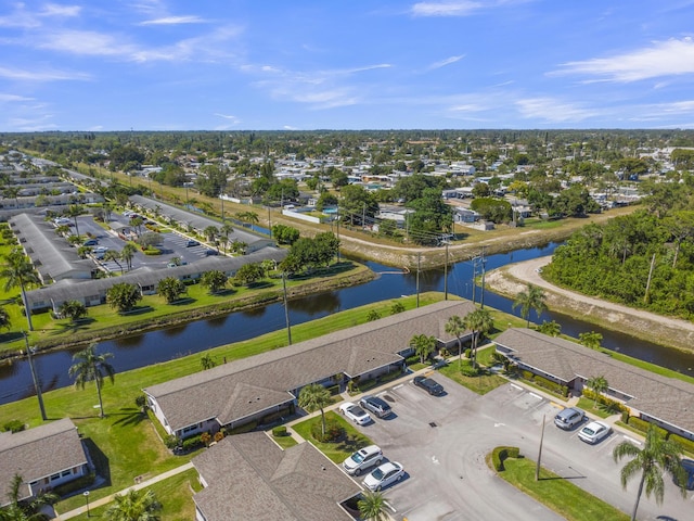 bird's eye view featuring a residential view and a water view