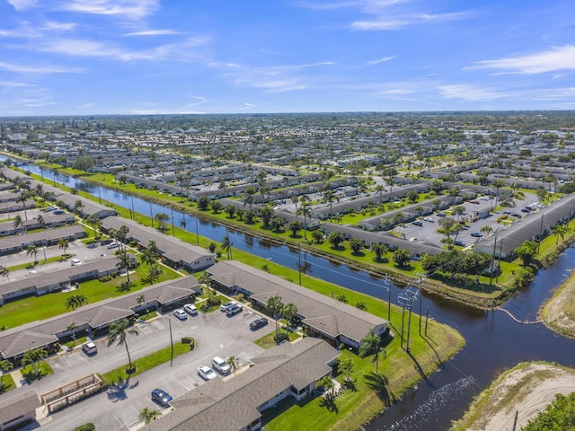 birds eye view of property with a residential view and a water view